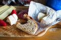 Cheese of camembert type, biten bread, raspberry. Royalty Free Stock Photo