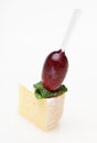 Cheese canape with grape and mint isolated Royalty Free Stock Photo