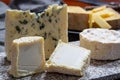 Cheese collection, French cheeses made from goat, cow and sheep melk: semi hard Roquefort blue cheese, soft Chabichou of Poitou