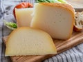 Cheese collection, French fol epi  cheese with many little holes, etorki  and ossau iraty cheese Royalty Free Stock Photo