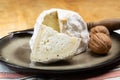 Cheese collection, soft cow French cheese with mold Gaperon artisanal lavored with cracked peppercorns and garlic produced in Royalty Free Stock Photo