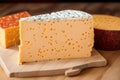 Cheese collection, variety of cheeses with tomatoes on wooden background. Generative AI
