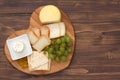 Cheese with cookies, grapes on tray heart