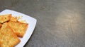 Cheese Crackers on White Plate with copy space area. Royalty Free Stock Photo