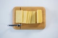 Cheese cutting board with slices of cheese