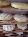 Cheese drying in wood shelves