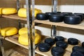 Cheese factory warehouse with shelves of product capretto and la Royalty Free Stock Photo