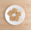 Cheese filled crackers on a white plate top view Royalty Free Stock Photo