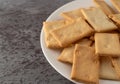 Cheese flavor crostini crackers on a white plate Royalty Free Stock Photo