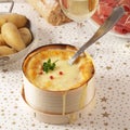 Cheese fondue with bacon, salami and potato- mont d`or