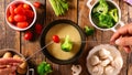 Cheese fondue with fresh vegetable- broccoli, tomato, potato