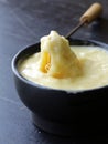 Cheese fondue - piece of bread (croutons)