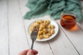 Cheese gnocchi with cheese sauce and bacon bits