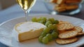 Cheese, grapes, crackers, and wine on a plate Royalty Free Stock Photo