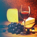 Cheese, grapes and glass of red wine. Royalty Free Stock Photo