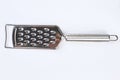 Cheese grater isolated on light background. Royalty Free Stock Photo