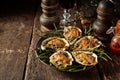 Cheese Gratin Oysters on Rustic Wooden Table