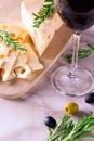 Cheese with green and black olives and glass of red wine Royalty Free Stock Photo