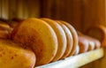 cheese heads on the counter in a gastronomic store Royalty Free Stock Photo