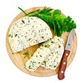 Cheese homemade with herbs on round board Royalty Free Stock Photo