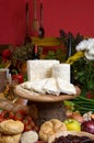 Cheese on knife board in rustic surrounding Royalty Free Stock Photo