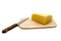 Cheese and Knife on a Cutting Board Royalty Free Stock Photo