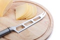 Cheese knife on cutting board Royalty Free Stock Photo