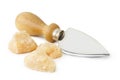 Cheese knife and flakes of parmesan Royalty Free Stock Photo