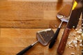 Cheese knives on rustic wood background, copy space