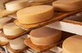 Cheese maturing on shelf - traditional aging method in small dairy