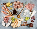 Cheese and meat appetizer selection or wine snack set. Variety of cheese, salami, prosciutto, bread sticks, baguette