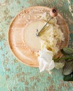 Cheese Monk Head sliced on a wooden round surface. White rose flower. Shallow depth of field. Royalty Free Stock Photo