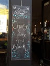 Cheese is the new black writing on a blackboard menu in a cafe