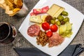 Cheese, nut and meat plate with bread sticks and red wine Royalty Free Stock Photo