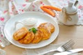 Cheese-pancakes with carrot on the white plate. Royalty Free Stock Photo