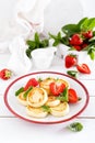 Cheese pancakes, fritters or syrniki with fresh strawberry and yogurt. Healthy and tasty breakfast Royalty Free Stock Photo