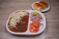 Cheese Pav Bhaji is a fast food dish from India, thick and spicy vegetable curry, fried and served with a soft bread roll / bun Royalty Free Stock Photo