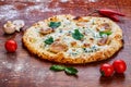 Cheese pizza with mushrooms on a wooden table