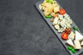 Cheese plate with Assorted cheeses Camembert, Brie, Parmesan blue cheese Royalty Free Stock Photo