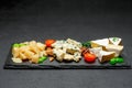 Cheese plate with Assorted cheeses Camembert, Brie, Parmesan blue cheese Royalty Free Stock Photo