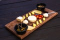 Cheese plate. Assortment of various cheese with nuts and olives Royalty Free Stock Photo