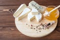 Cheese plate with Brie, Camembert, Roquefort Royalty Free Stock Photo