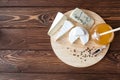 Cheese plate with Brie, Camembert, Roquefort Royalty Free Stock Photo