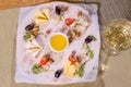 Cheese plate with cheeses Dorblu, Parmesan, Brie, Camembert and Roquefort in serving on the table from an old tree close Royalty Free Stock Photo