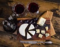 Cheese plate with grape and wine on wood Royalty Free Stock Photo