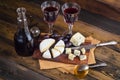 Cheese plate with grape and wine on wood Royalty Free Stock Photo