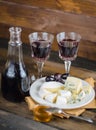 Cheese plate with grape and wine on wood Royalty Free Stock Photo