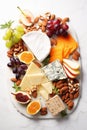 Cheese plate with grapes and nuts. Selective focus. Royalty Free Stock Photo