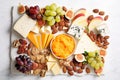 Cheese plate with grapes and nuts. Selective focus. Royalty Free Stock Photo