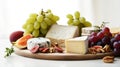 Cheese plate with grapes and nuts. Selective focus. Royalty Free Stock Photo